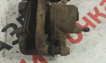 Суппорт тормозной правый Toyota Platz седан 1SZ-FE