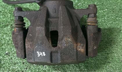Суппорт тормозной передний правый Toyota NZE144