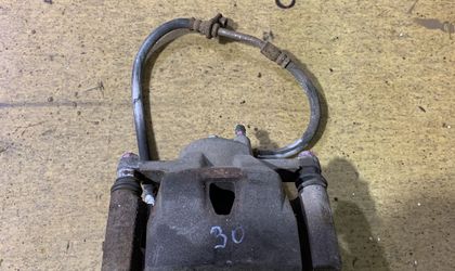 Суппорт тормозной передний левый Belta/Vitz