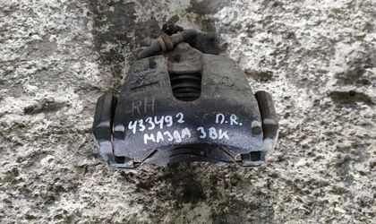 Суппорт тормозной передний правый Mazda 3 I (BK) 