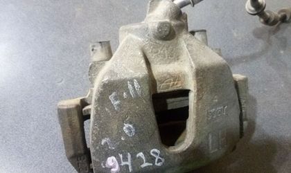Суппорт тормозной передний левый Ford Focus II 