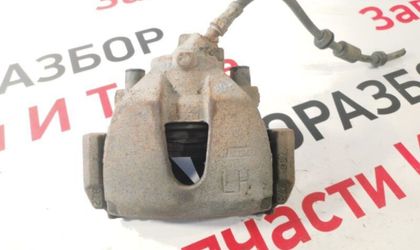 Суппорт тормозной передний левый Ford Focus