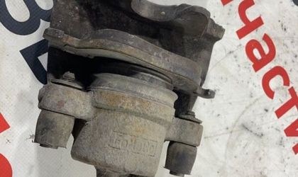 Суппорт тормозной передний левый Ford Focus