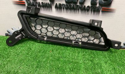 Решетка радиатора левая Mitsubishi Lancer X рест