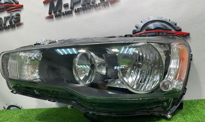 Фара левая Mitsubishi Lancer 10